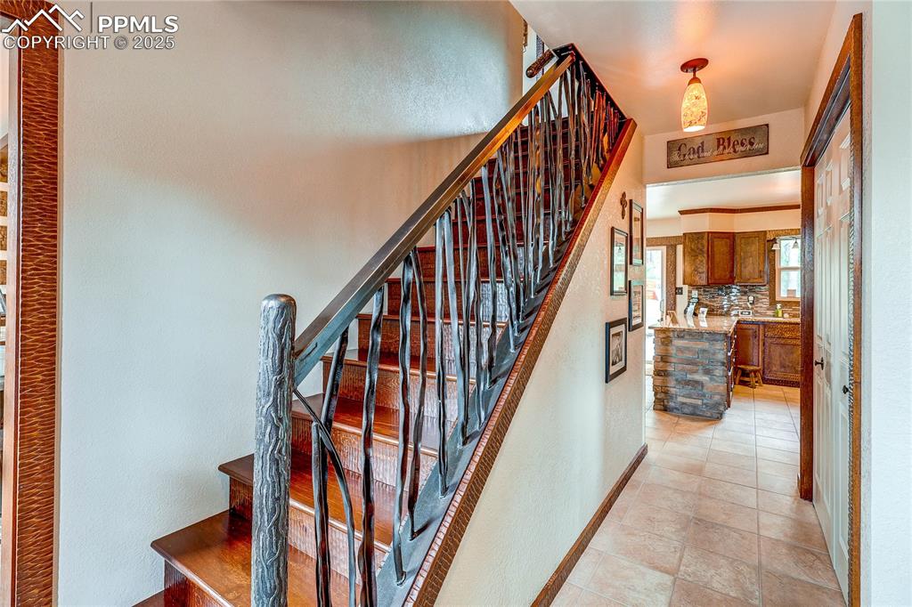 Image 19 of 49: Staircase to upstairs