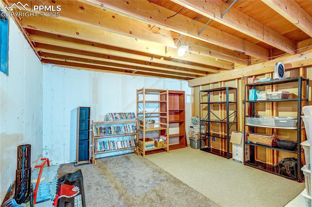 Image 32 of 49: Unfinished basement featuring carpet