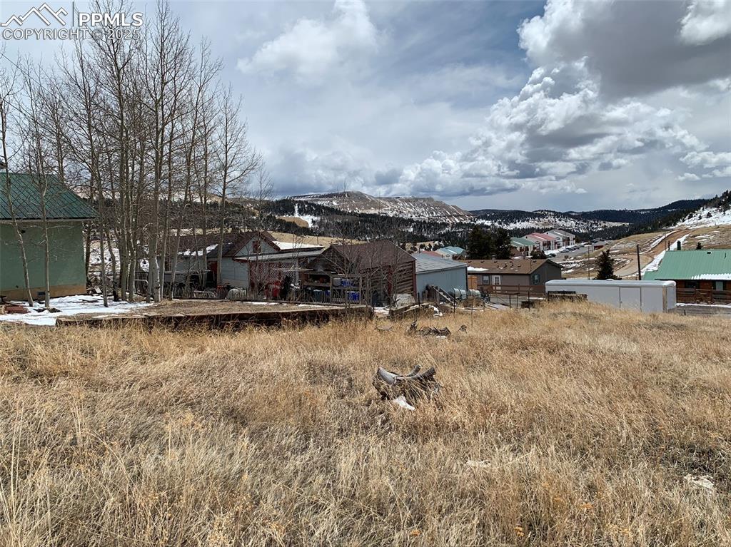 Image 12 of 22: View of yard with a mountain view
