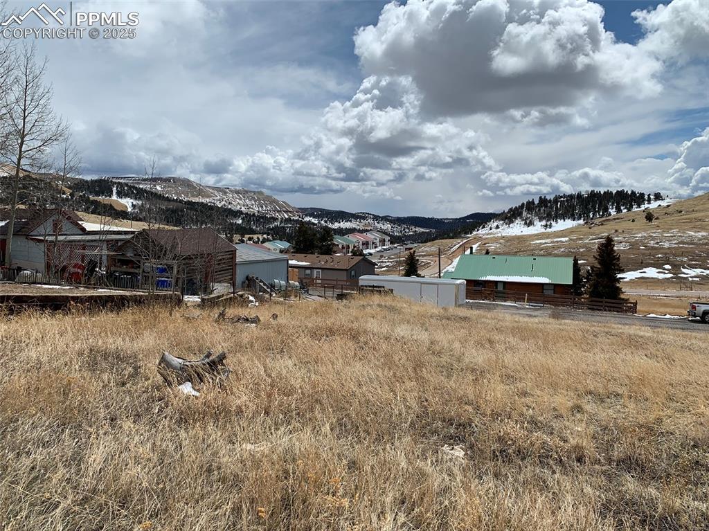 Image 7 of 22: View of yard with a mountain view and an outbuilding