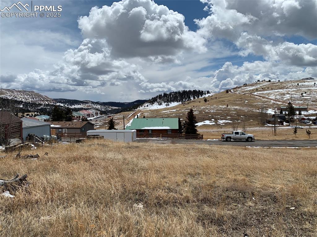 Image 8 of 22: View of yard featuring a mountain view