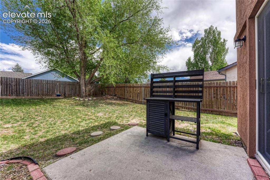 Image 26 of 33: Walkout to charming patio.