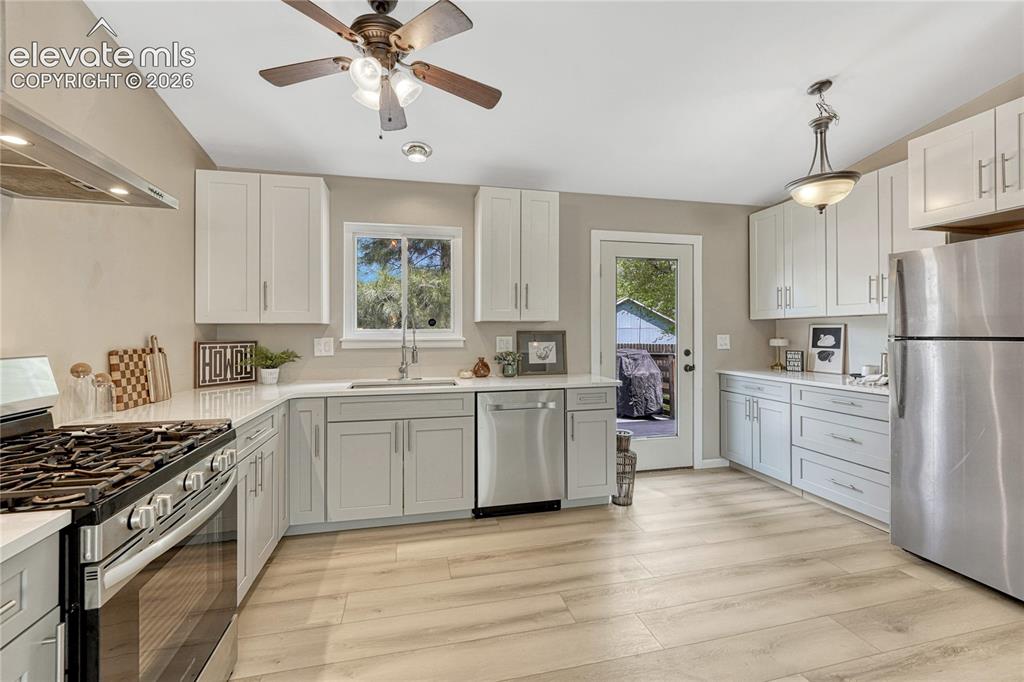 Image 4 of 33: Door with large window lets in ample natural light.