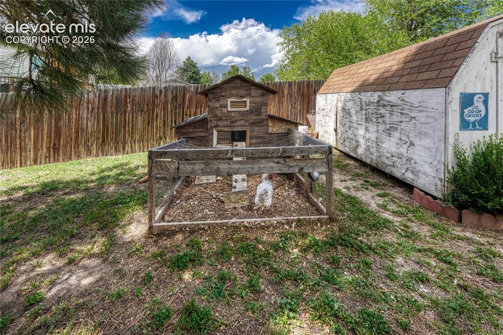 Image 9 of 33: Chicken coop (and chicken) included if desired!