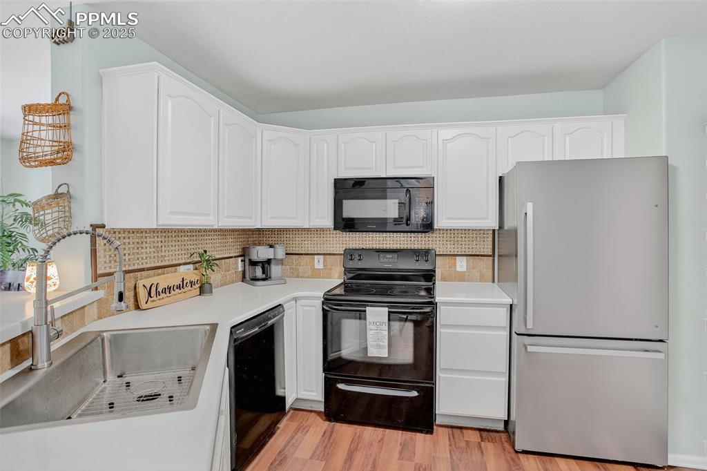Image 10 of 26: Kitchen featuring quartz counters, farm sink
