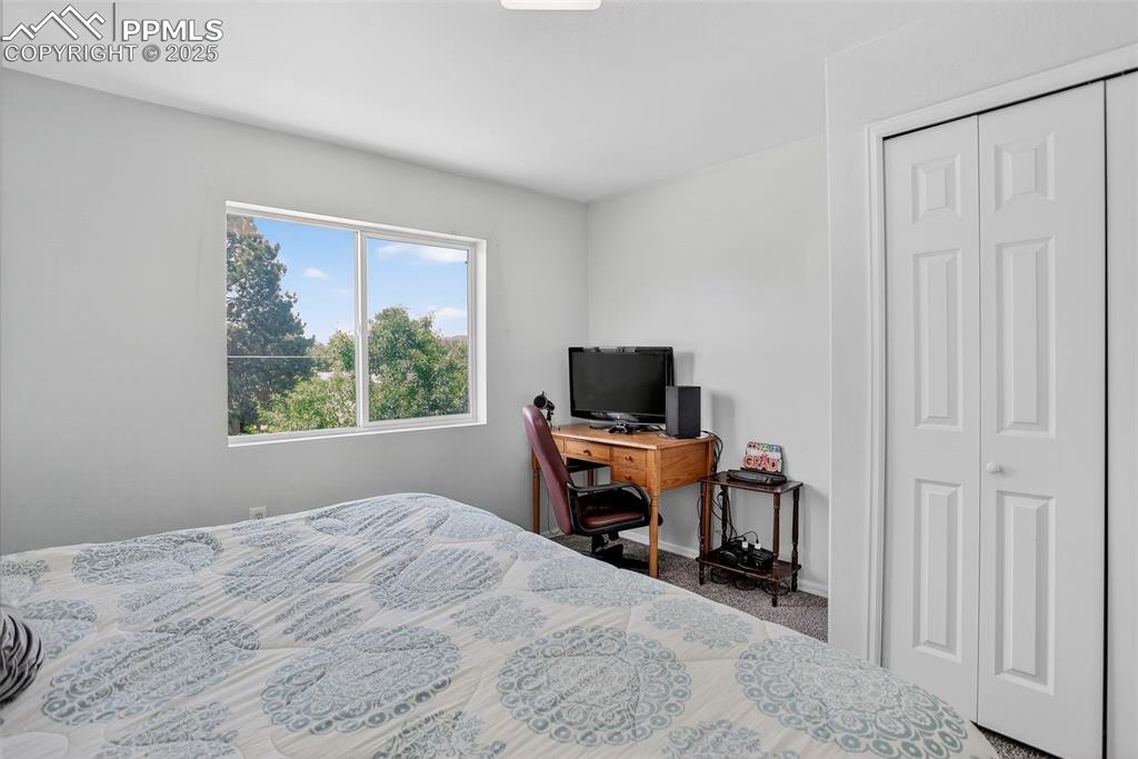 Image 15 of 26: Carpeted bedroom featuring mtn views and double door closet