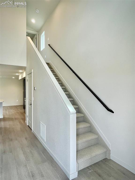 Image 6 of 19: Stairs to upper level bed and bath
