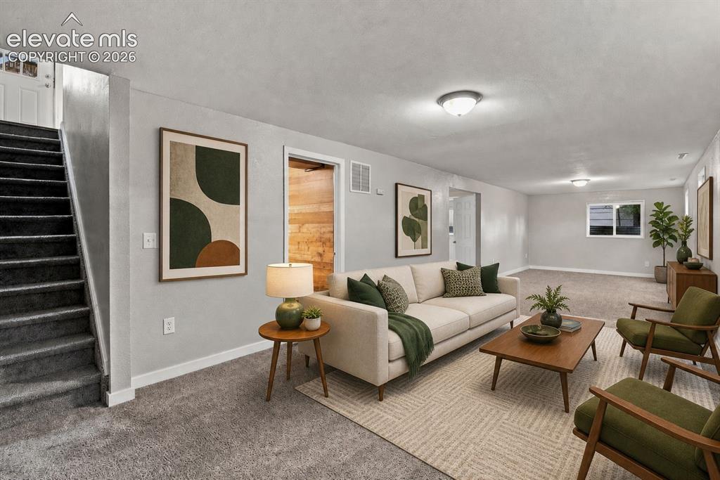 Image 23 of 34: Huge basement area with carpeted flooring throughout, recessed window, whit