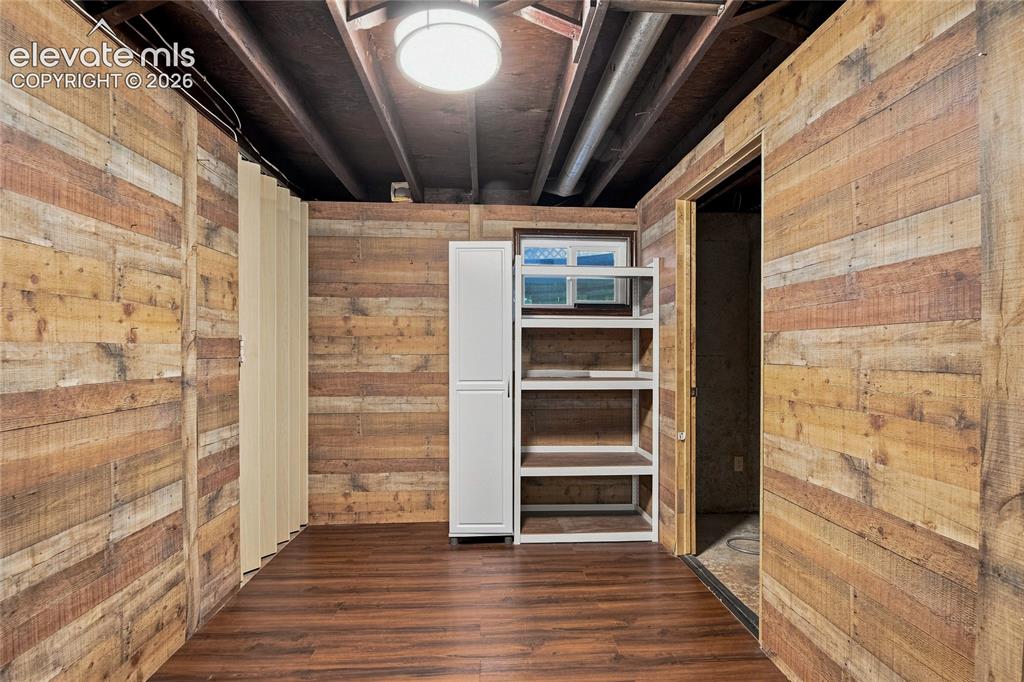 Image 30 of 34: Basement office or storage space