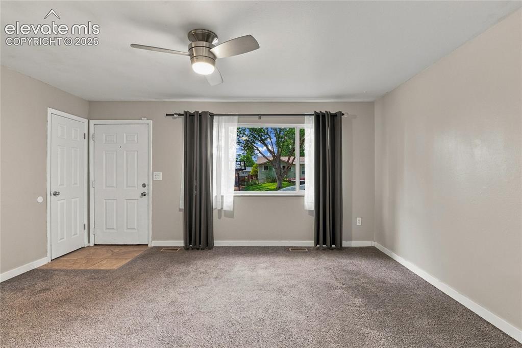 Image 7 of 34: Front entrance and coat closet in living room