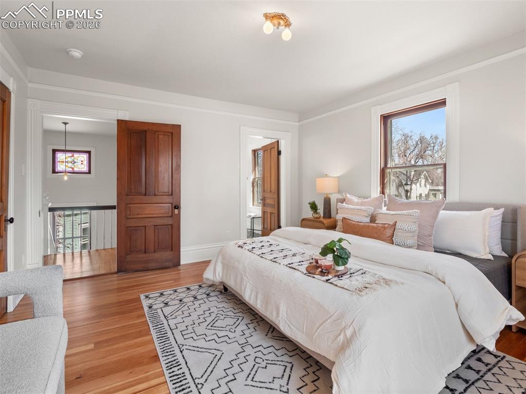 Image 11 of 41: The primary bedroom has a newly added en-suite bathroom.