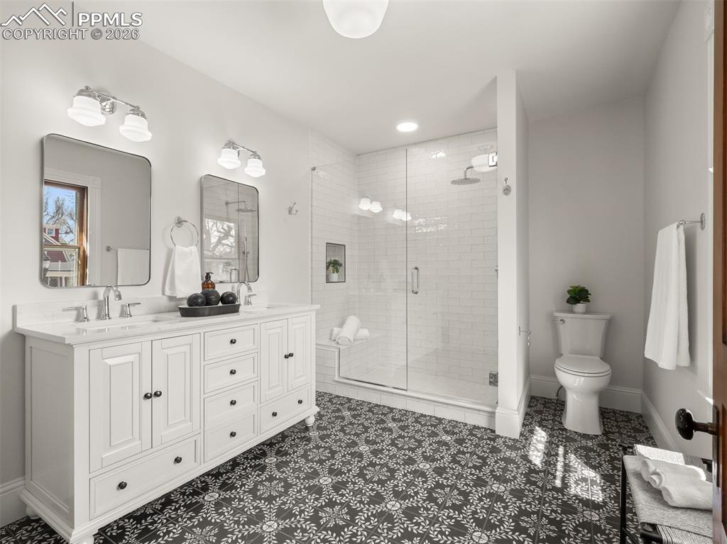 Image 12 of 41: Newly added primary bath with large walk in shower and double vanity.