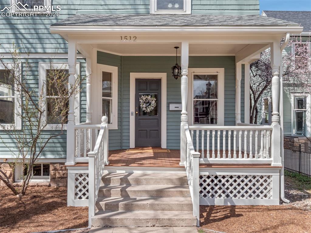 Image 2 of 41: Enjoy sitting on the covered front porch with morning coffee or evening dri