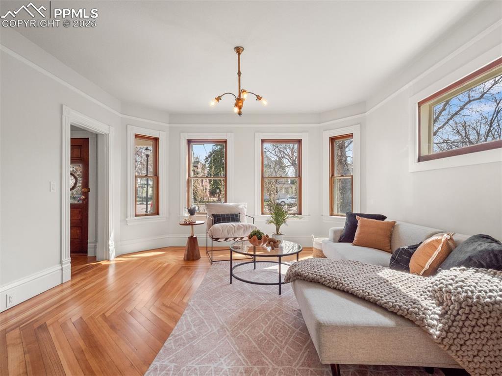 Image 20 of 41: The refinished original Fir floors have a beautiful log cabin design.