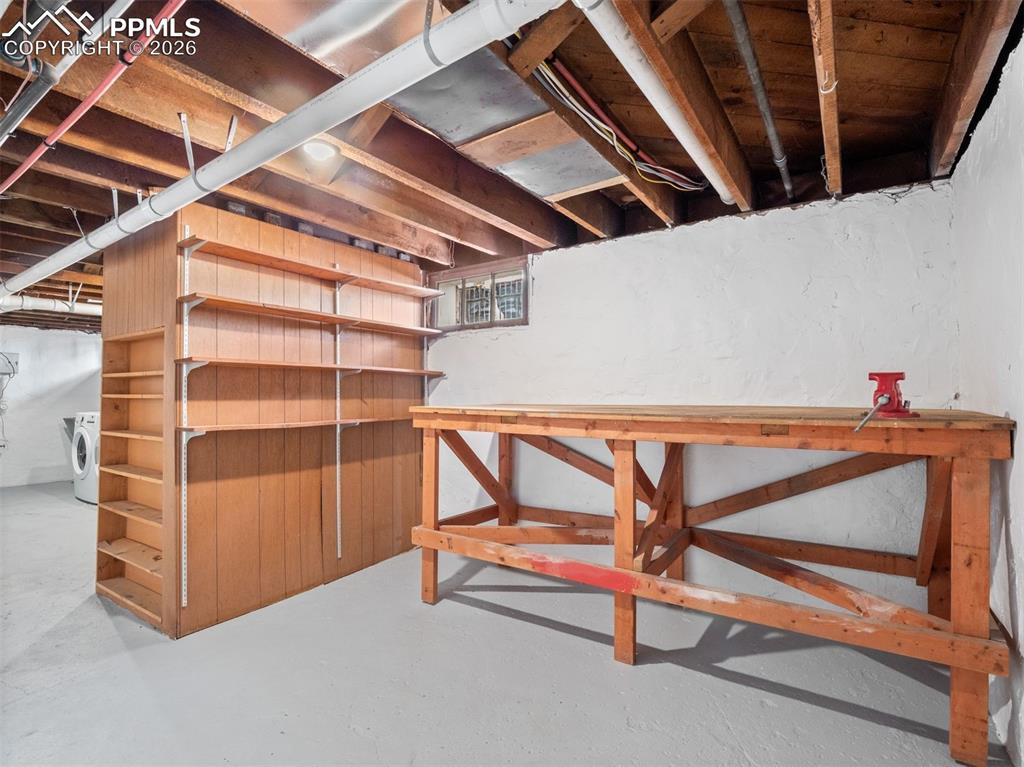 Image 30 of 41: Large storage room/work shop area.