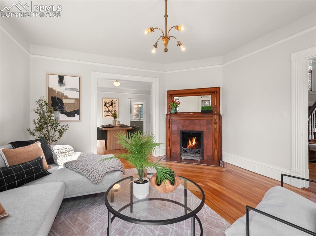 Image 4 of 41: The original coal burning fireplace is non functioning and decorative.