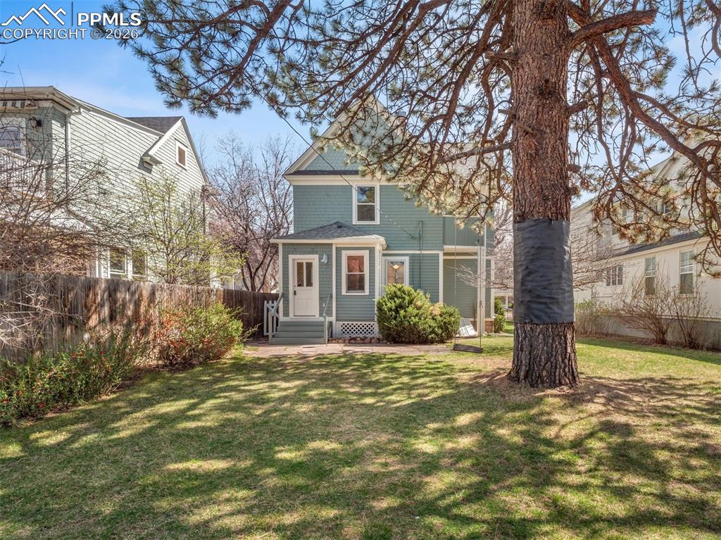 Image 7 of 41: Full 9,500 SQ.Ft. lot with alley access, mature trees and shrubs.