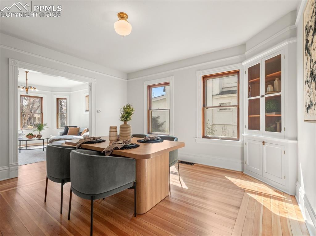 Image 9 of 41: The dining room features a built in china cabinet and picture rails with or