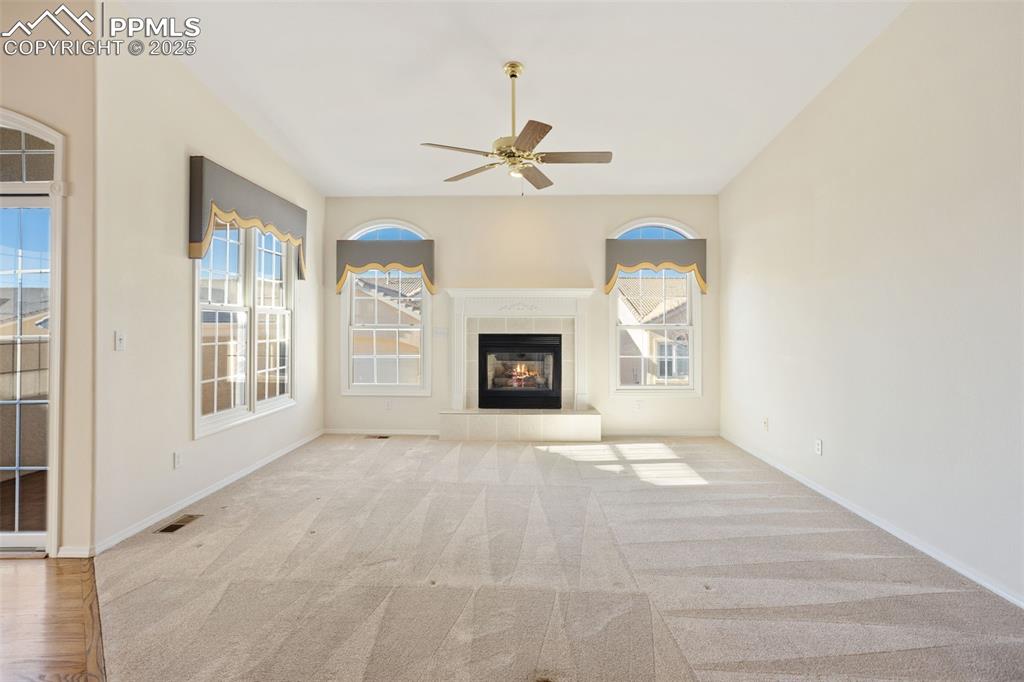 Image 10 of 36: Light and Bright Living Room with Gas Fireplace!