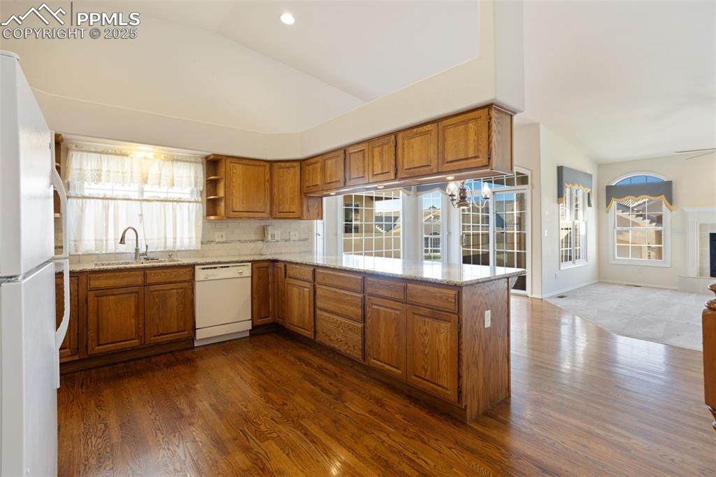Image 6 of 36: Kitchen Opens up to Dining Area and Living Room!