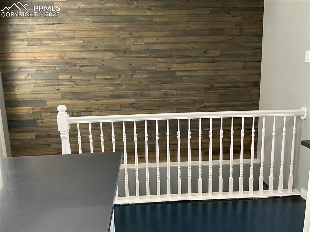 Image 10 of 43: Kitchen looking towards the stairwell/ Quartz countertop/Breakfast bar