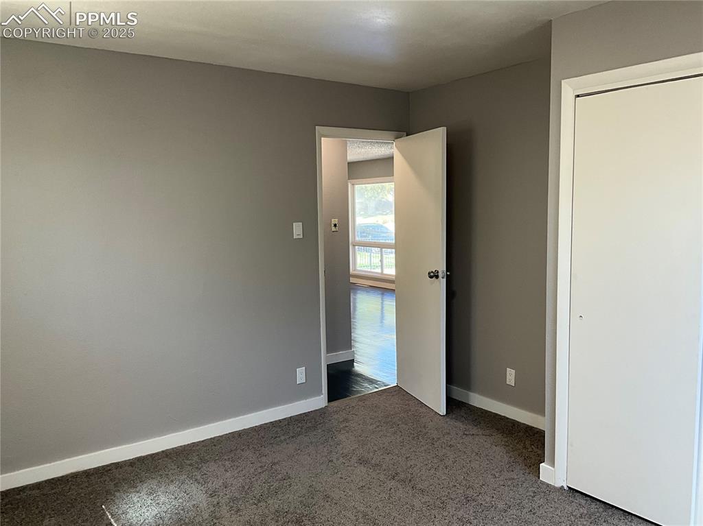Image 12 of 41: Unfurnished bedroom featuring new carpet and a closet