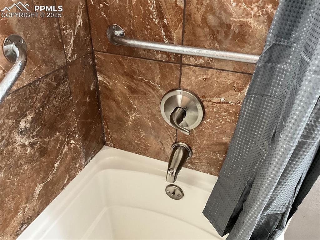 Image 24 of 43: Bathroom view of a tub to relax in