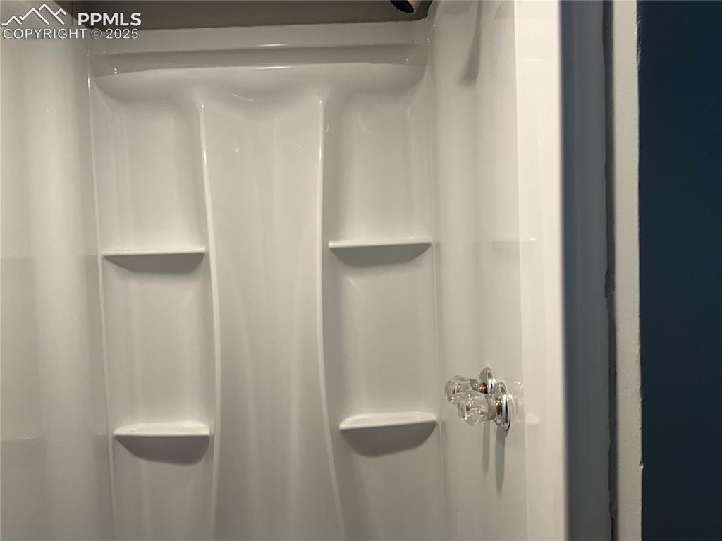 Image 29 of 41: Bathroom view of a shower stall