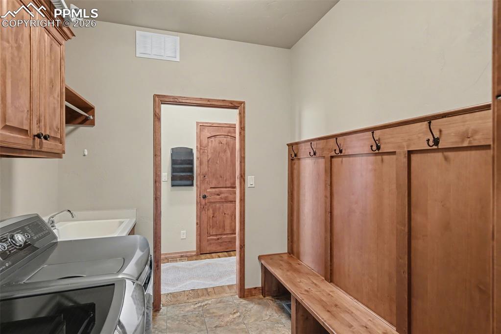 Image 24 of 49: Office featuring French doors and ample light