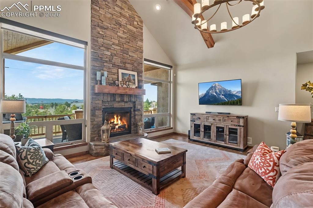 Image 7 of 49: Beautiful hardwood floors beckon you into the expansive great room, featuri
