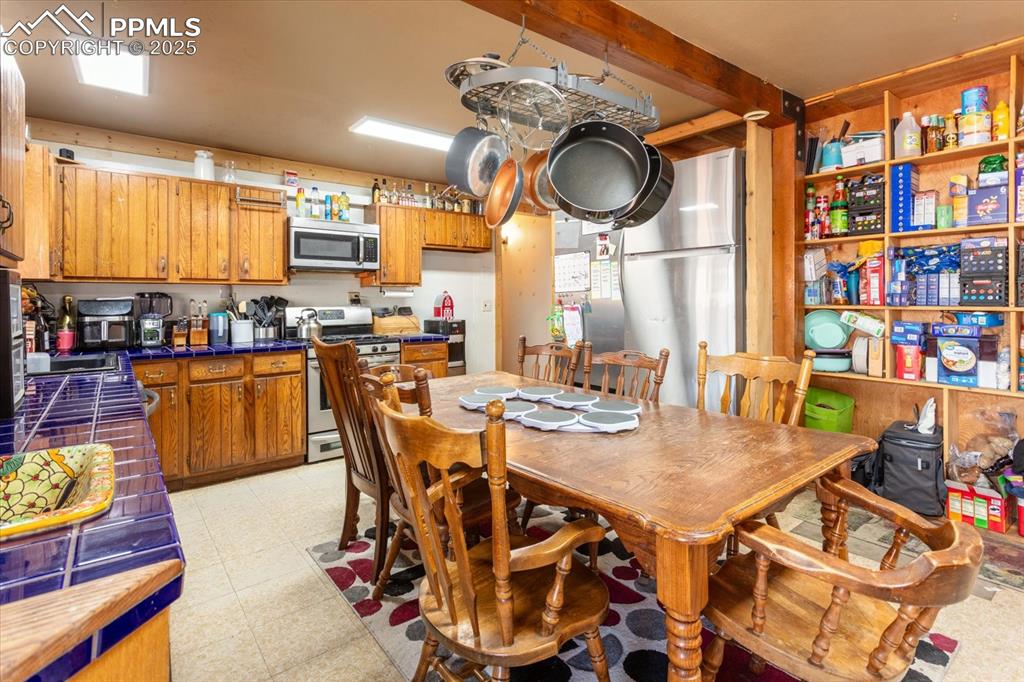 Image 12 of 45: Dining space featuring light floors