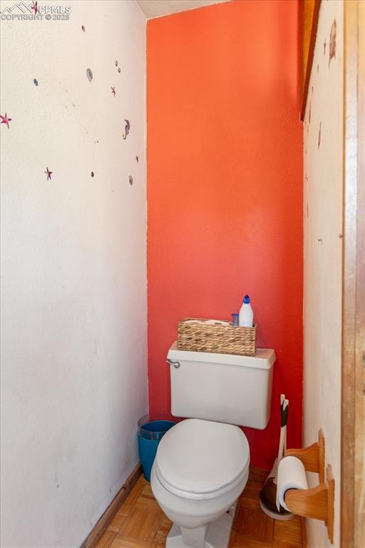Image 30 of 45: Bathroom featuring toilet and baseboards