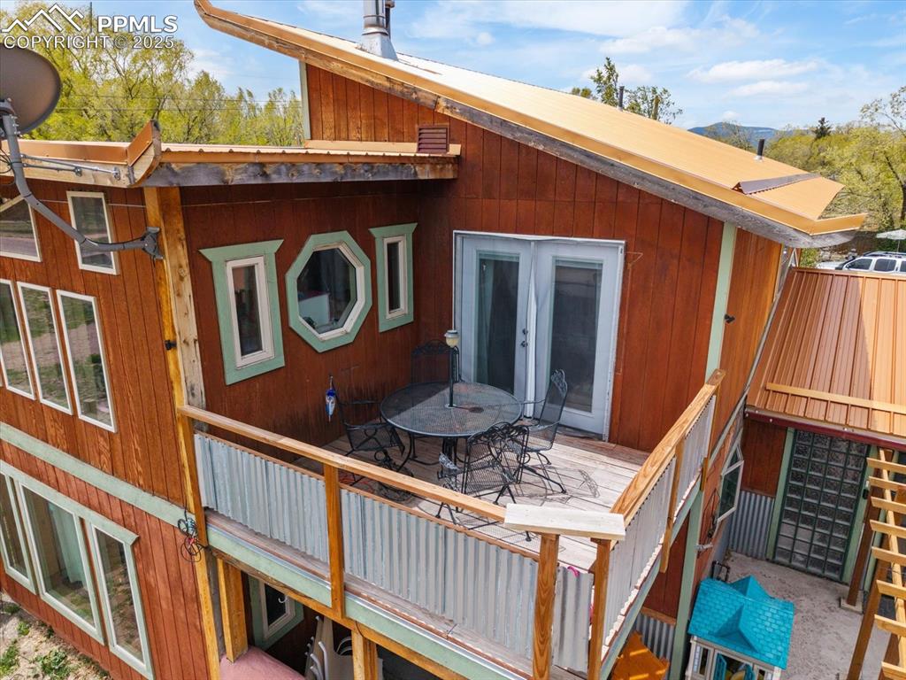 Image 4 of 45: Wooden deck featuring french doors