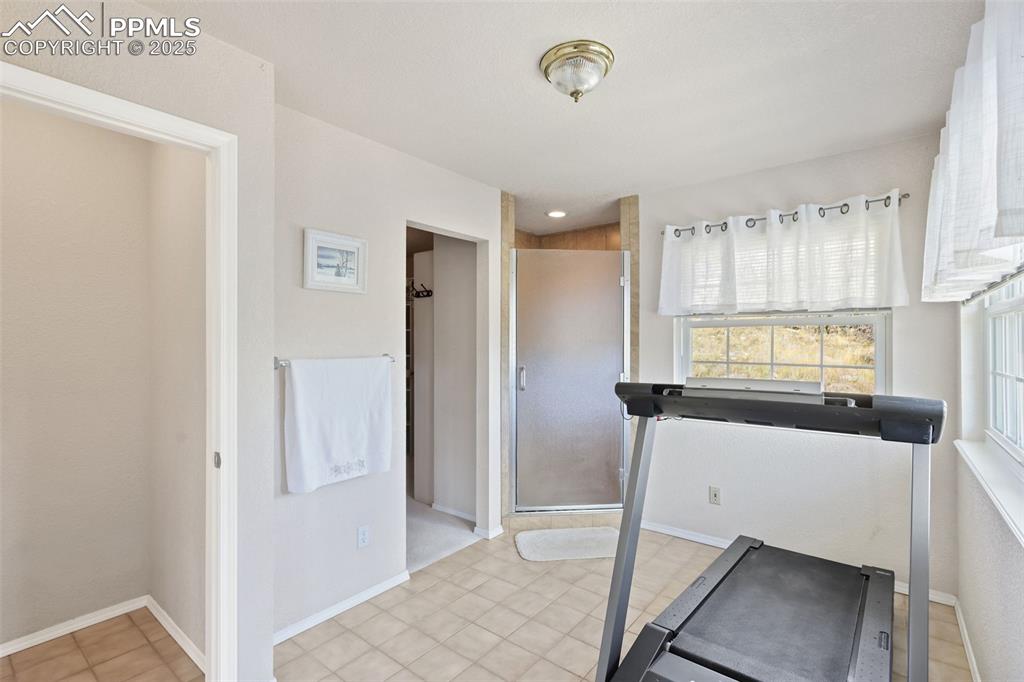 Image 20 of 49: Exercise area with baseboards