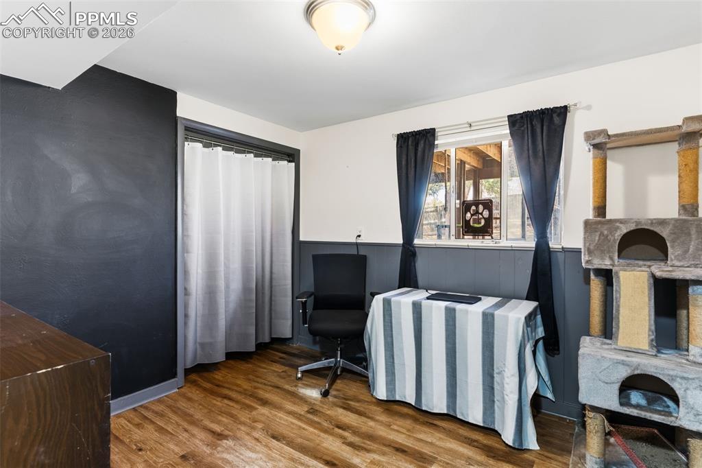 Image 23 of 35: Bedroom on lower level used as an office