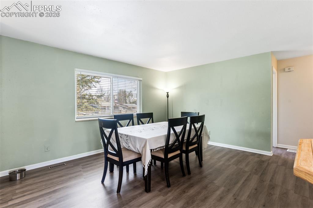 Image 6 of 35: Living room currently used as a dining area