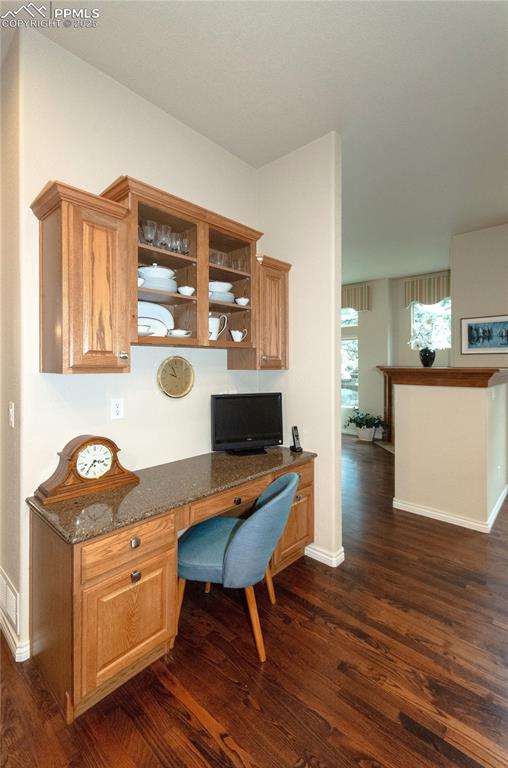 Image 16 of 43: Built-in desk area offers a space for work, organization and planning withi