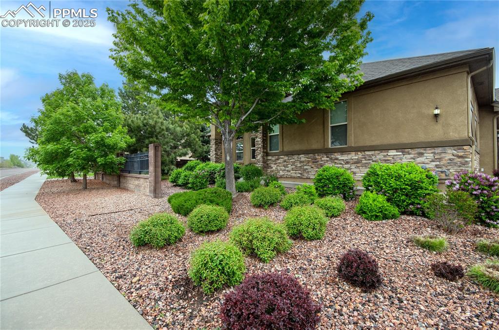 Image 3 of 43: Corner lot landscaping.