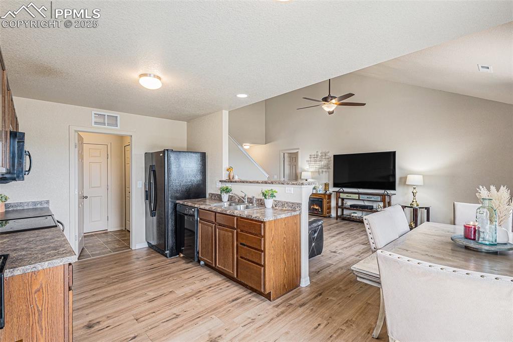 Image 10 of 36: Kitchen with Vinyl Plank Flooring
