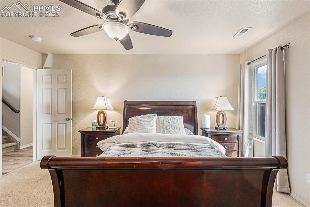 Image 19 of 36: Master Bedroom with Oversize Carpet
