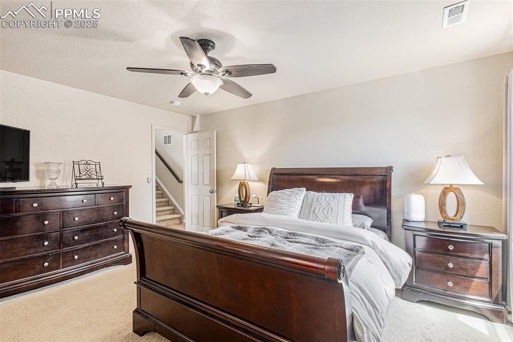 Image 21 of 36: Master Bedroom with Lighted Ceiling Fan
