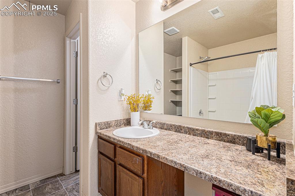Image 22 of 36: Bathroom with Tile Flooring

