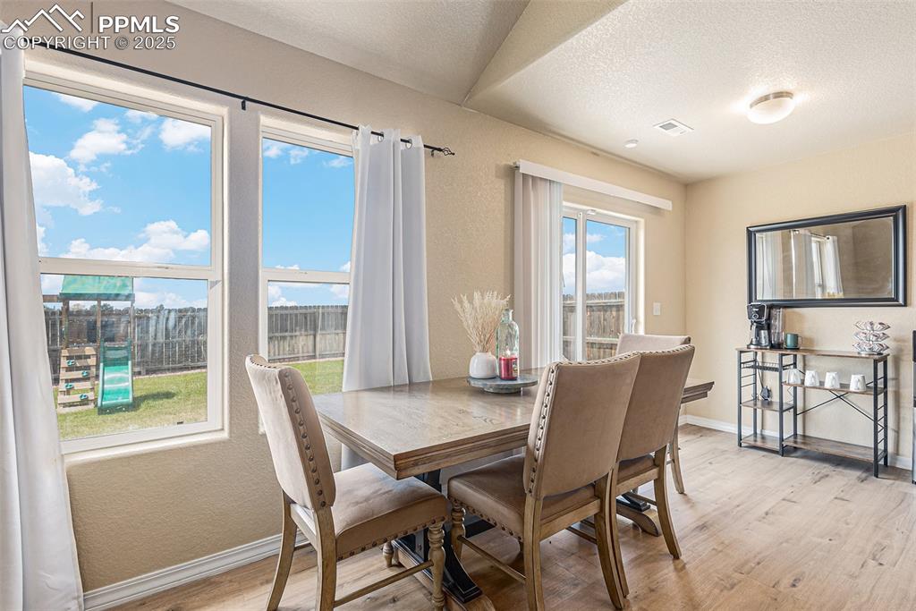 Image 9 of 36: Dining Room with Large & Windows
