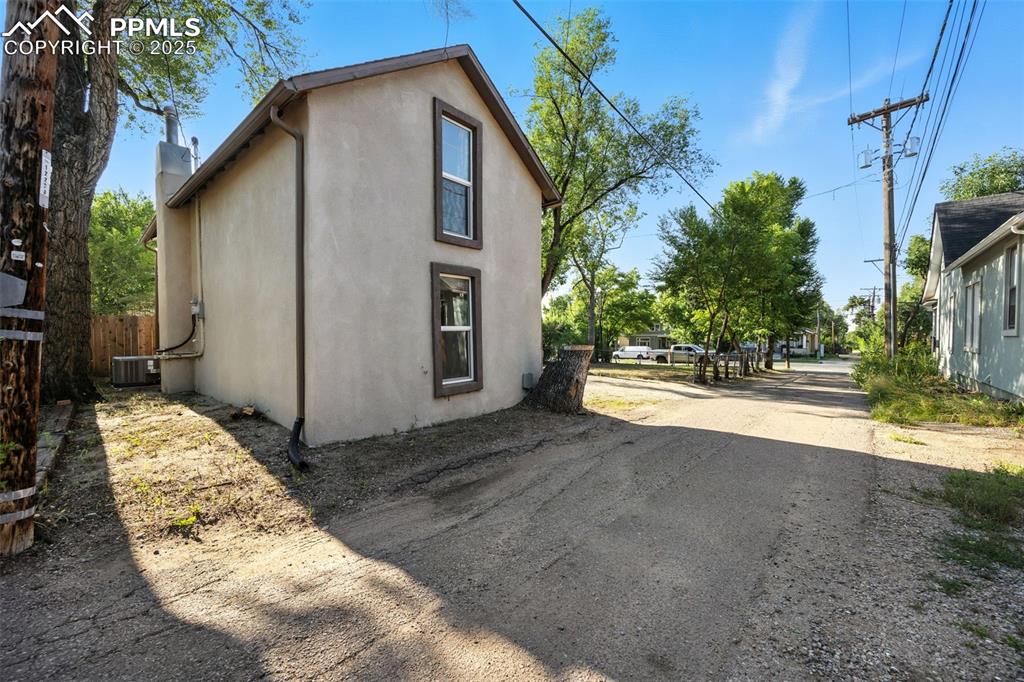 Image 7 of 25: View of property exterior featuring stucco siding