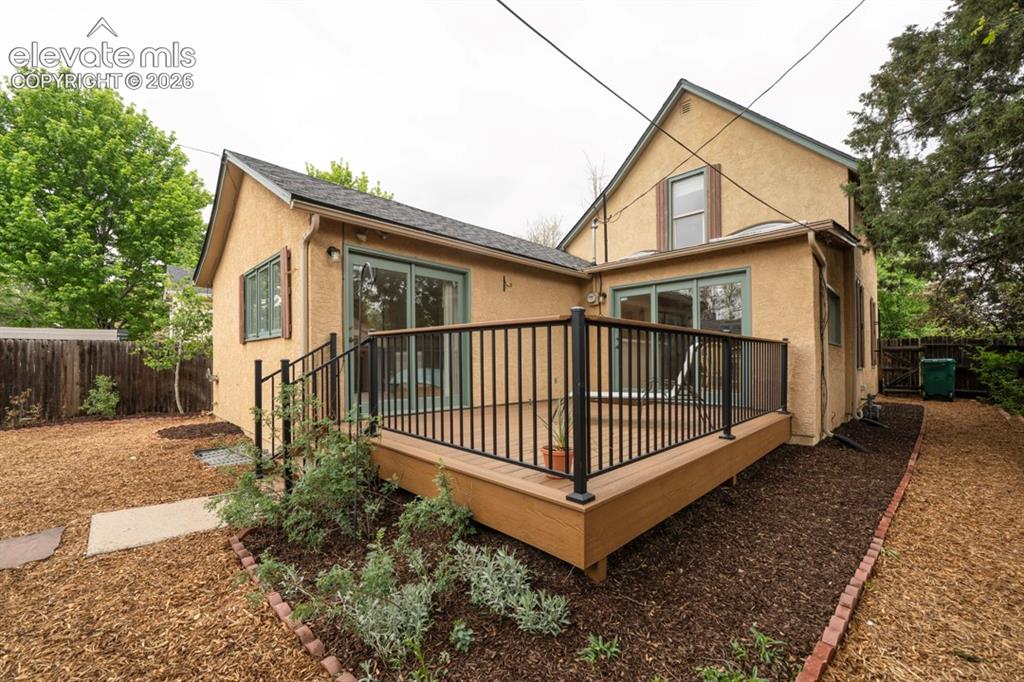 Image 3 of 40: Composite Deck w/Wrought Iron Railing