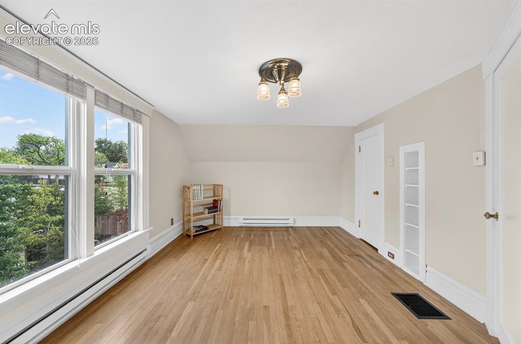 Image 30 of 40: Secondary Bedroom w/hardwood floors