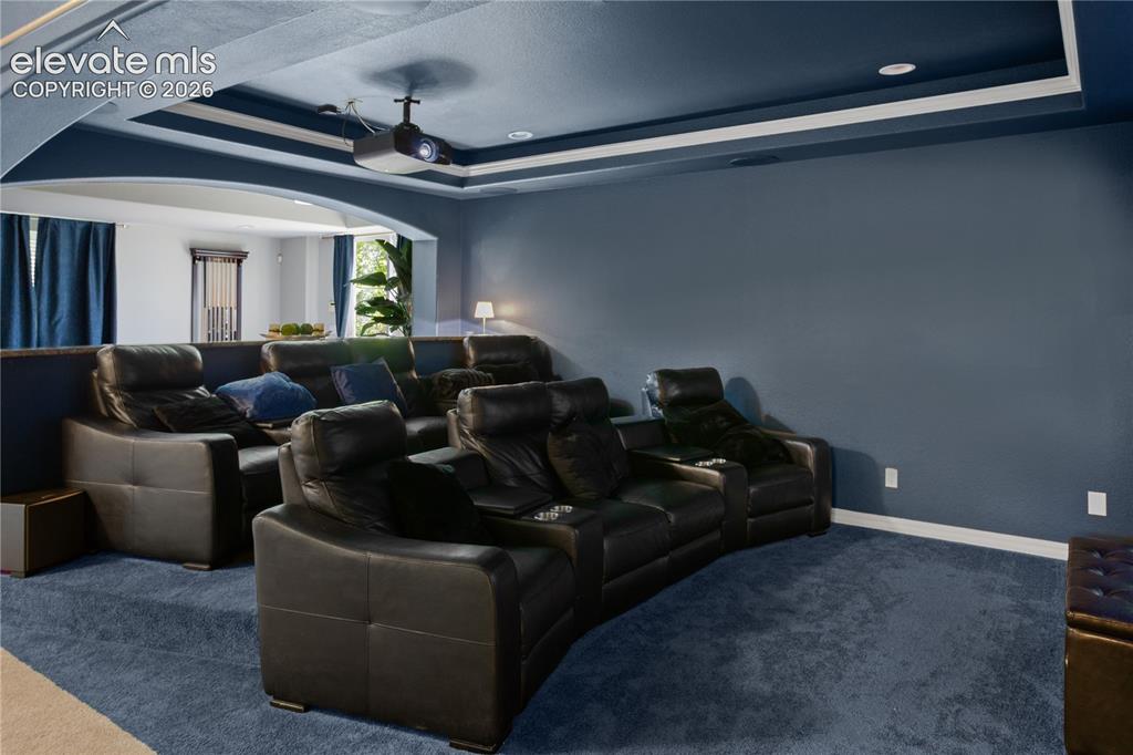 Image 24 of 38: Black out curtains are just one of the special things this media area has t