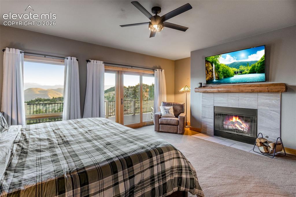 Image 27 of 50: wood burning fireplace (features gas stub for conversion), wood mantel, cei