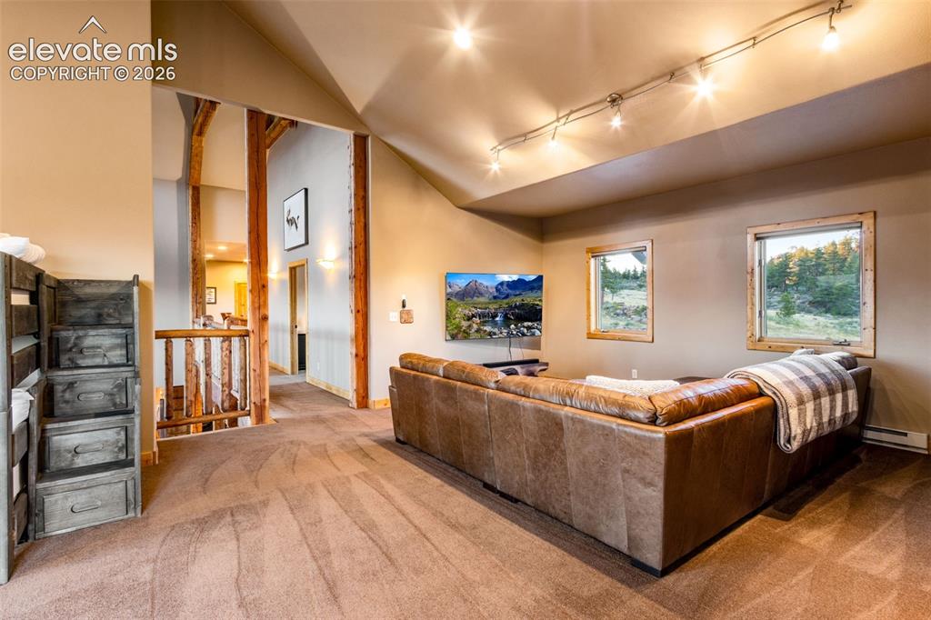 Image 39 of 50: The loft can be used as another bedroom. It is also a great place to watch