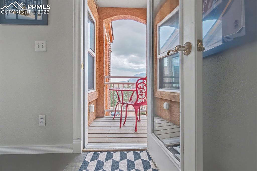 Image 16 of 42: Upper level Juliette balcony off the upper staircase landing